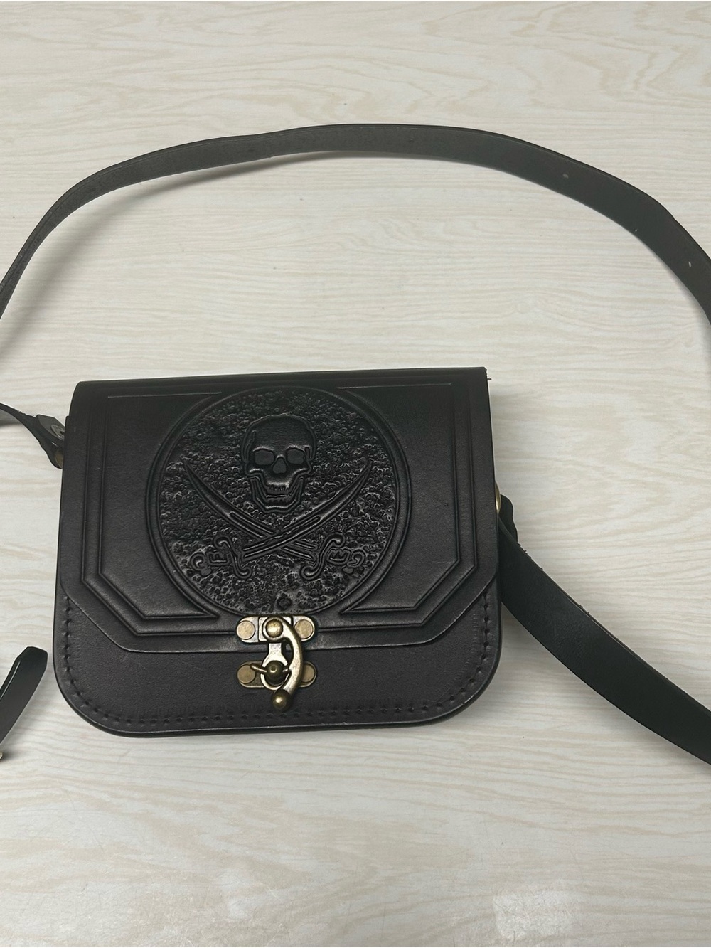 Black Embossed Skull Crossbody Bag with Antique-Gold Clasp
